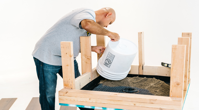 man using bucket dry pack shower
